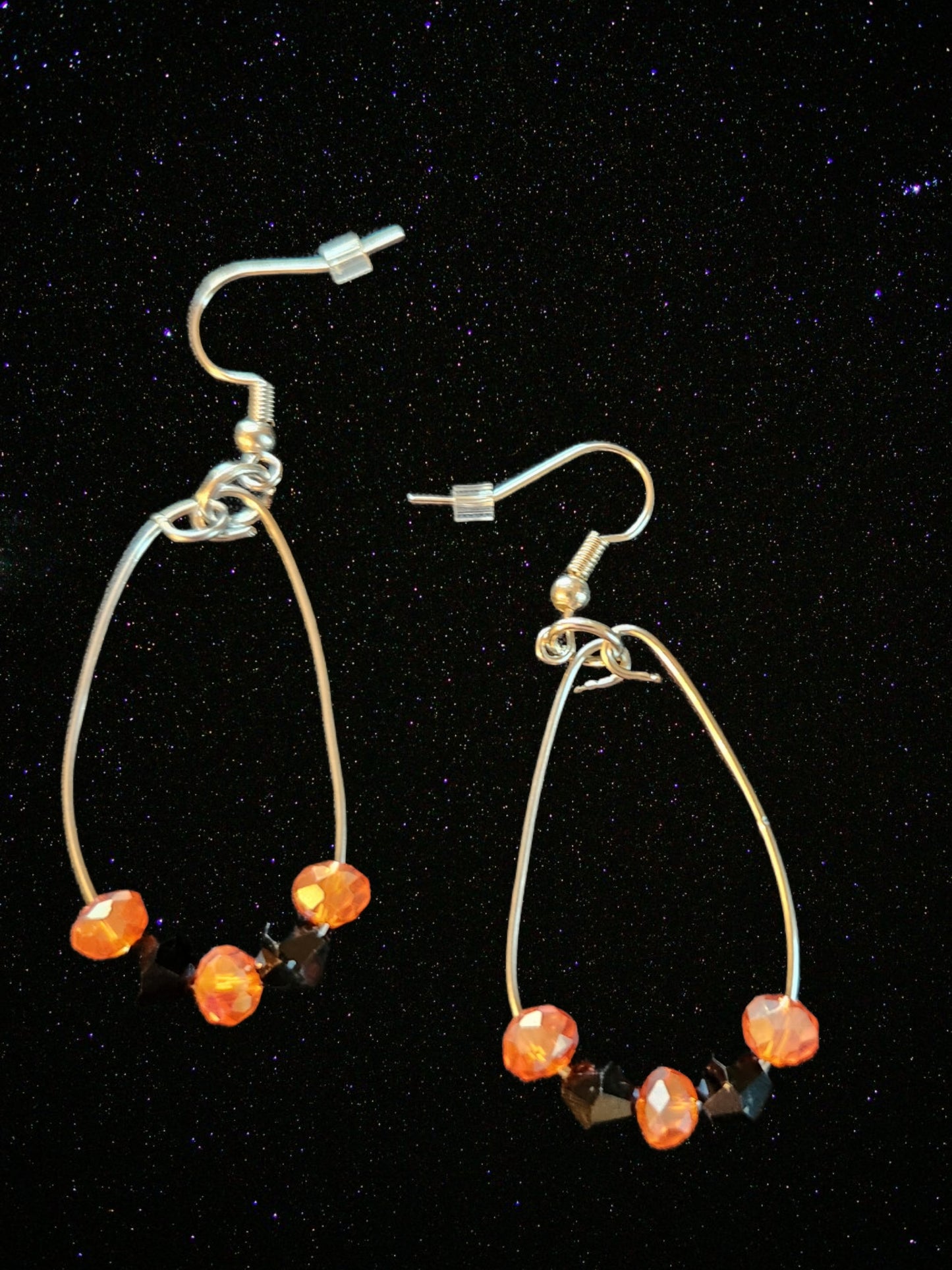 Orange and black hoop dangle earrings